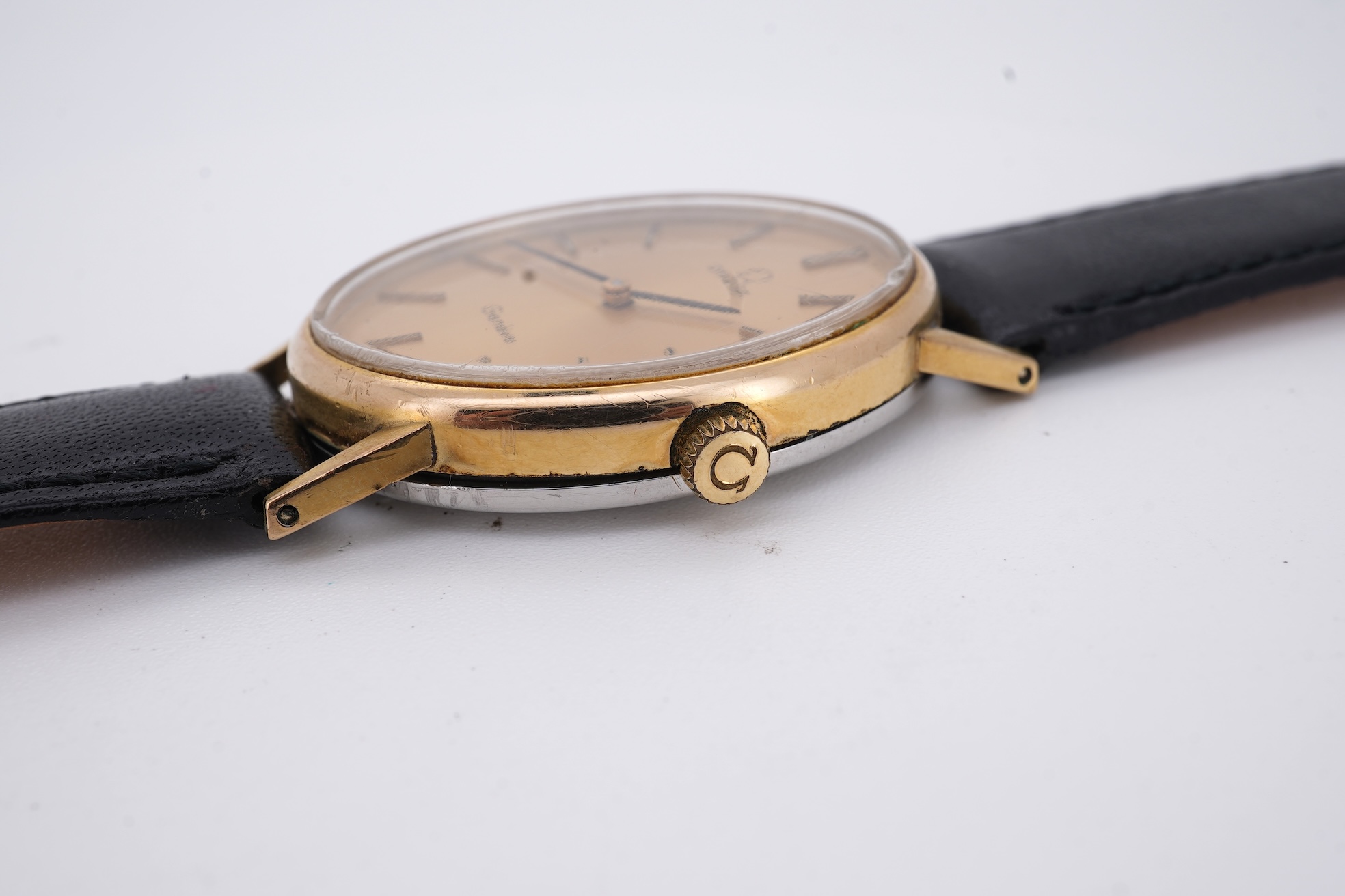 A lady's early 1970's steel and gold plated Omega manual wind wrist watch, with oval dial and baton numerals, case diameter 26mm, movement c.620, on an associated leather strap, with box no papers.